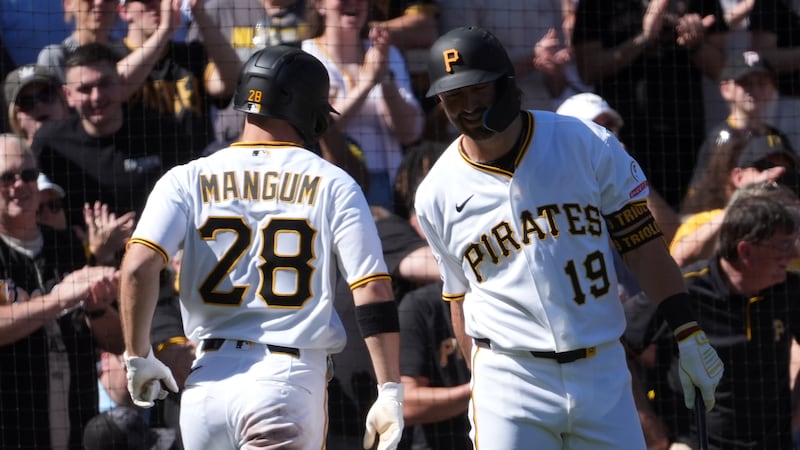 Mangum homers and drives in two as Pirates hold off Twins