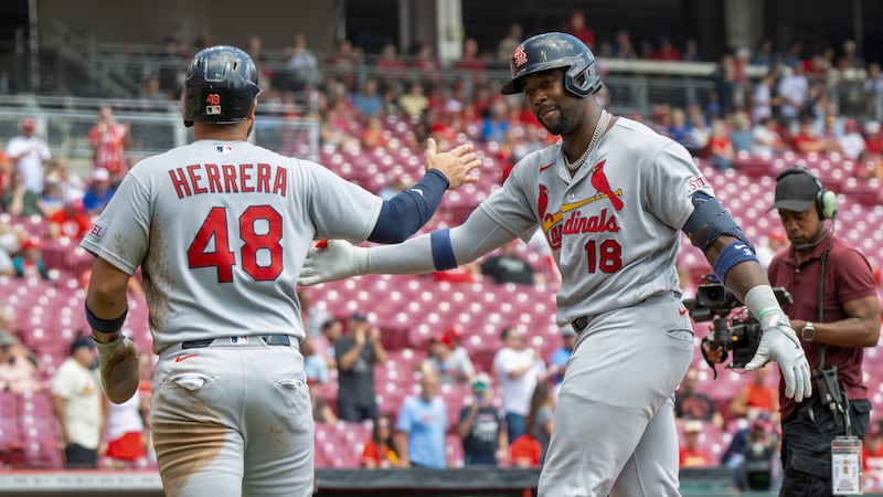 Myers’ dropped fly with 2 outs in 9th gives Cardinals a wild win over Reds