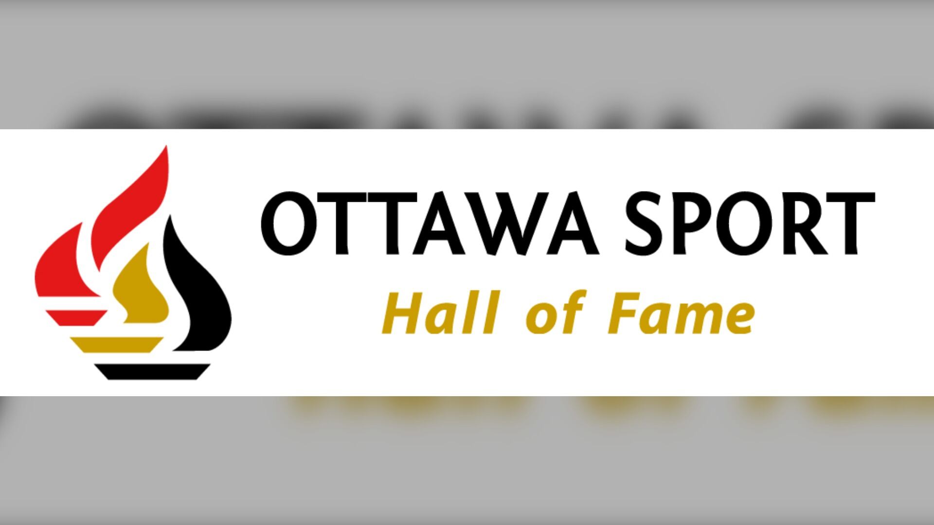 The Ottawa Sport Hall of Fame logo. There is a stylized picture of a flame next to the words "Ottawa Sport Hall of Fame"