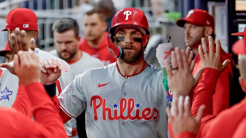 Harper leads Phillies past Braves in 10 innings to stop 10-game losing streak
