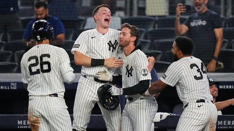 Yankees rally with 2 outs in 9th inning and beat Braves in 10 after long rain delay