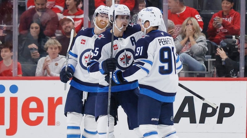 Connor scores a pair of power-play goals as Jets squeak past Red Wings