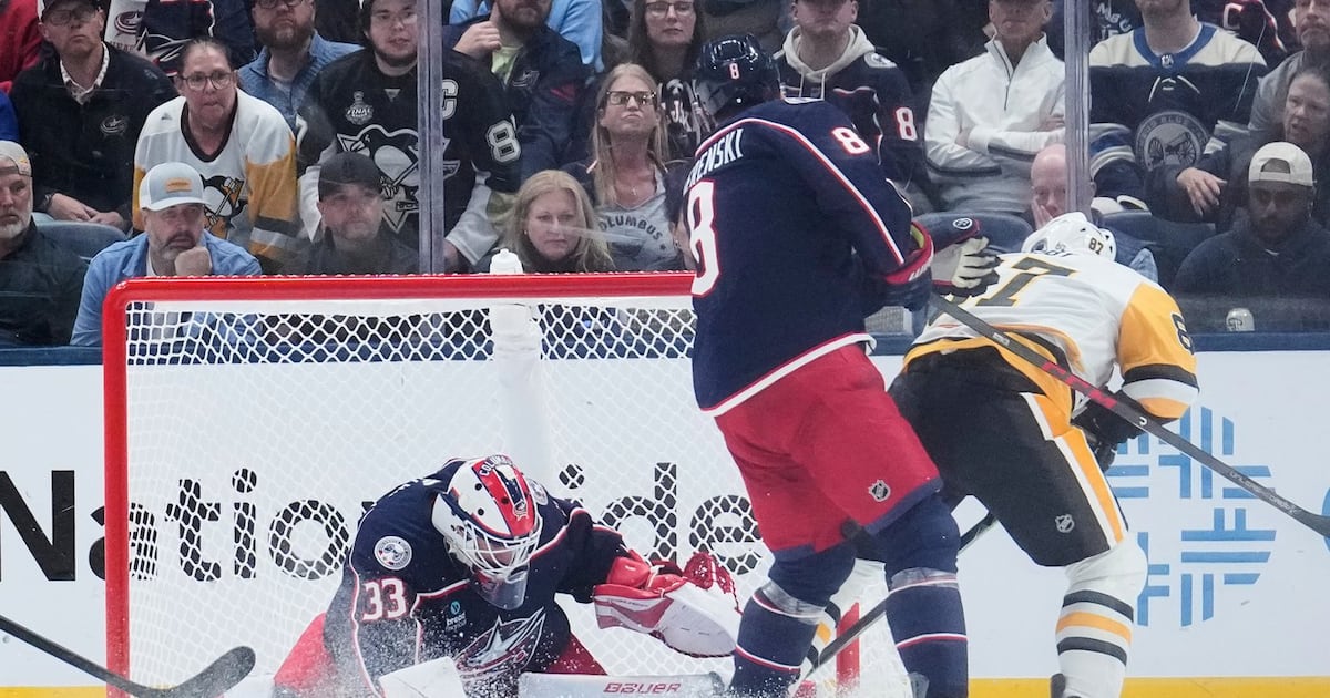 Photo: tsn.ca Columbus Blue Jackets goalie Cam Talbot (33) blocks a shot by Pittsburgh Penguins center Sidney Crosby (87), next to Zach