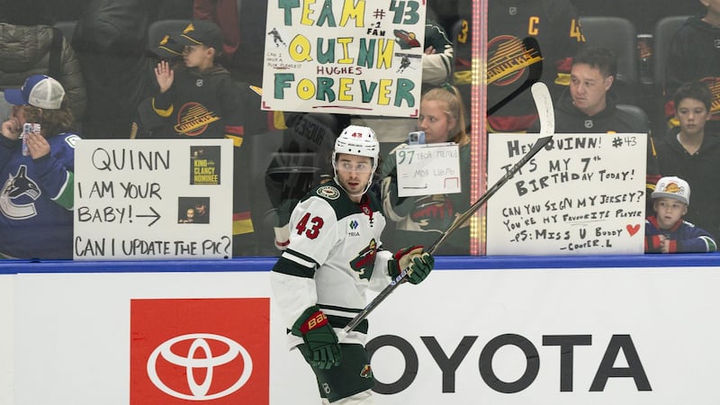 Hughes scores after hearing boos, some cheers in return to Vancouver