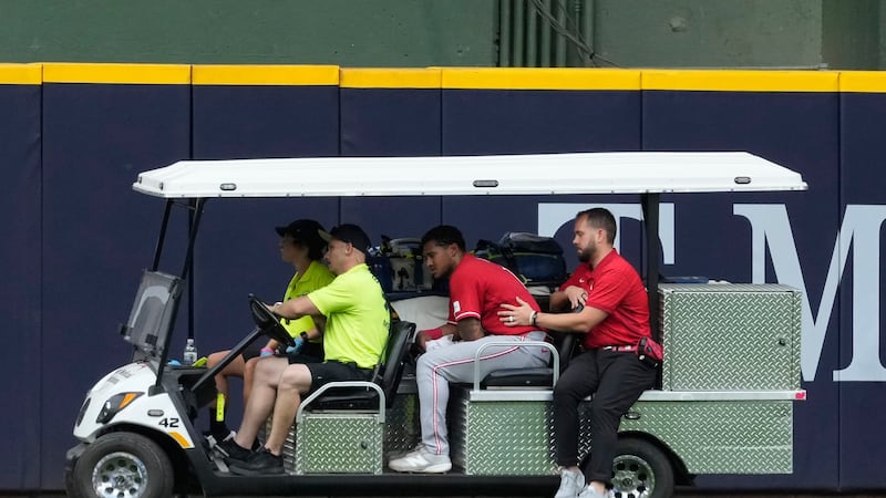 Reds’ Myers carted off field after crashing into wall