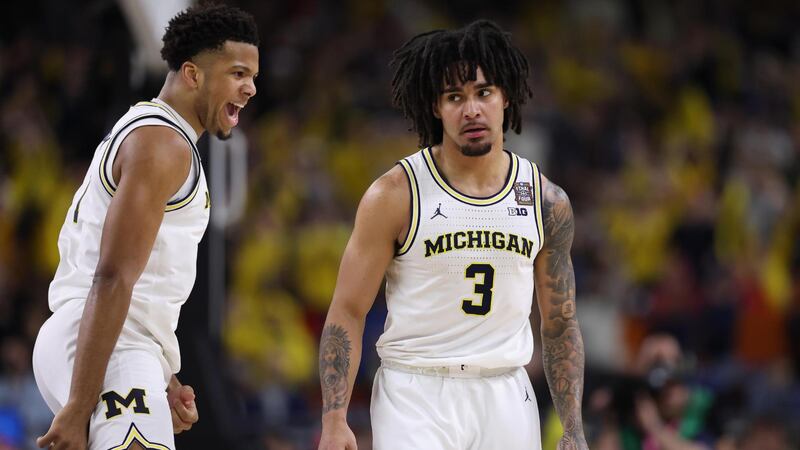 Elliot Cadeau helps Michigan pull away with a 3