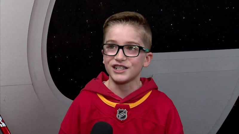 10-year old Flames fan talks about emotional stick handoff from Dustin Wolf