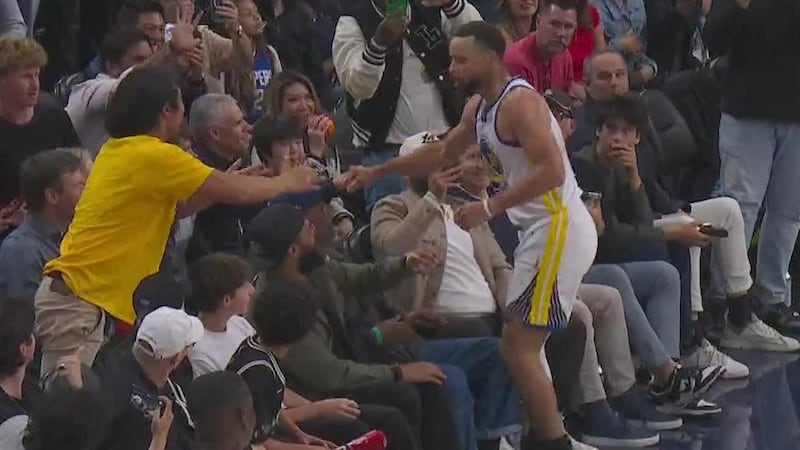 Steph Curry fired up after hitting go-ahead three falling into the crowd