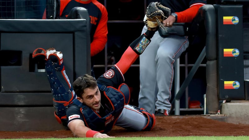 Must See: Millas makes a beautiful sliding grab behind the plate for Nationals