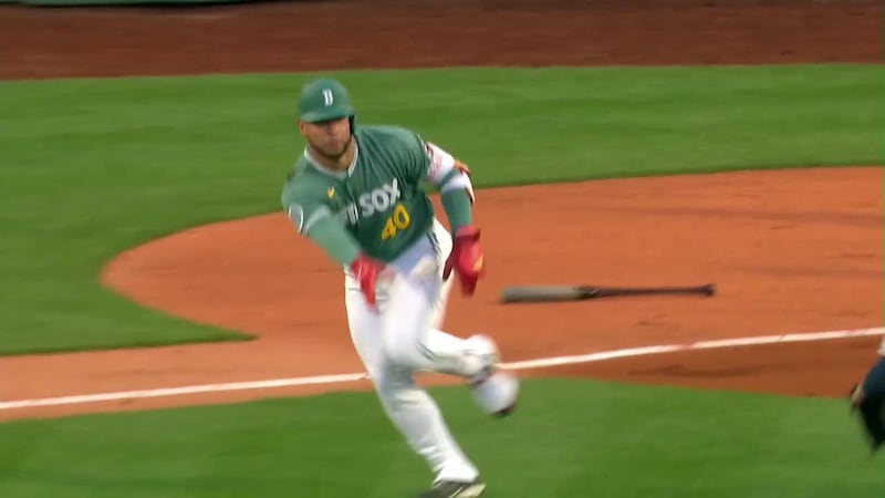 Red Sox's Willson Contreras throws ball back to pitcher after getting hit