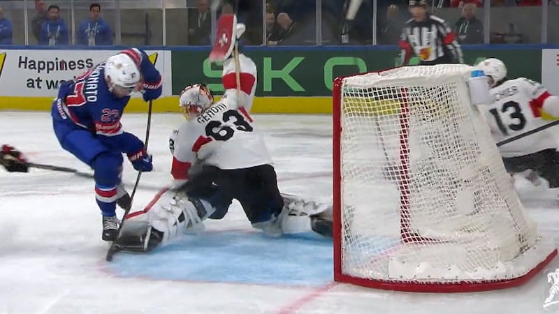 Switzerland's Genoni kicks out the leg to deny Coronato of a goal