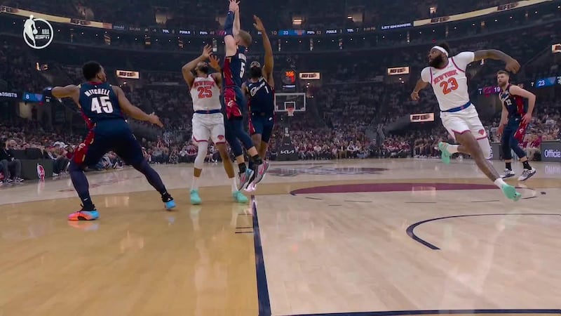 Mitchell Robinson gets way up for a two-handed alley-oop jam