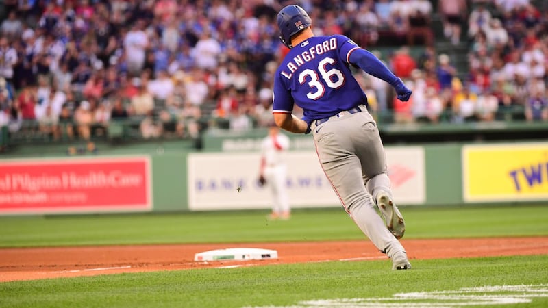 Wyatt Langford sends the first pitch of the night way over the Green Monster