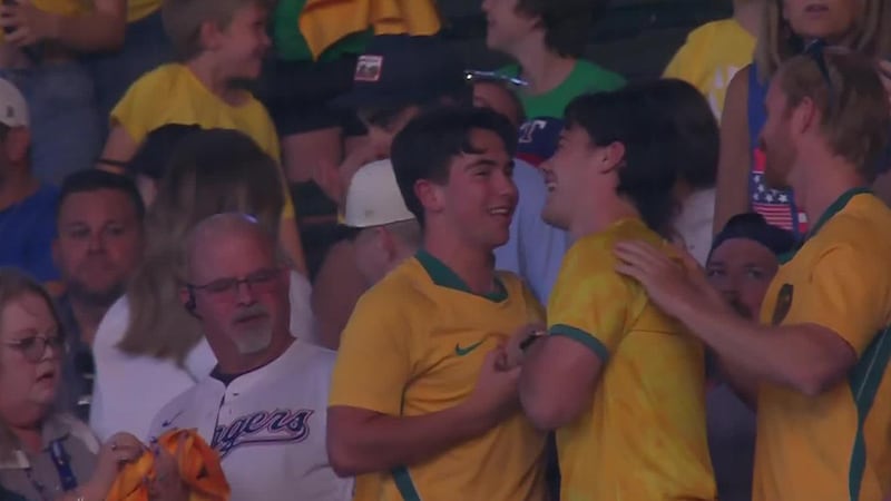 Aussie soccer fan celebrates after catching foul ball at Rangers game
