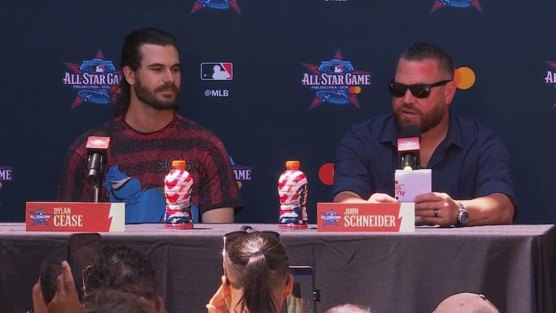 Schneider reads off his starting lineup for the American League for the All-Star Game