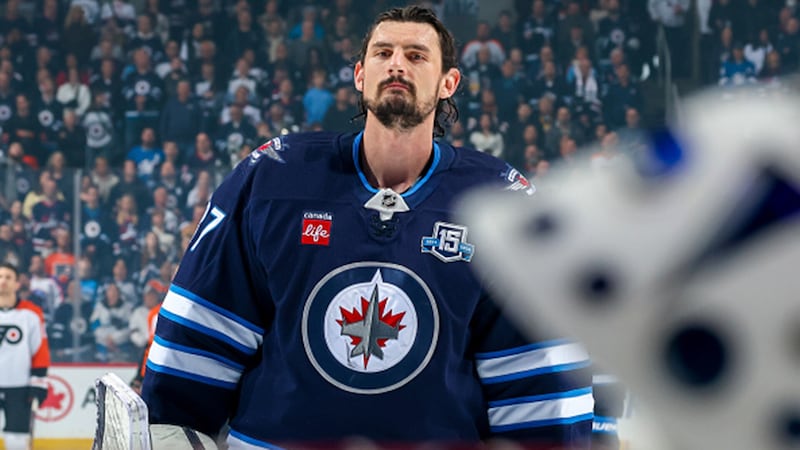 Will Hellebuyck not reporting to camp force Cheveldayoff to move quicker on a trade?