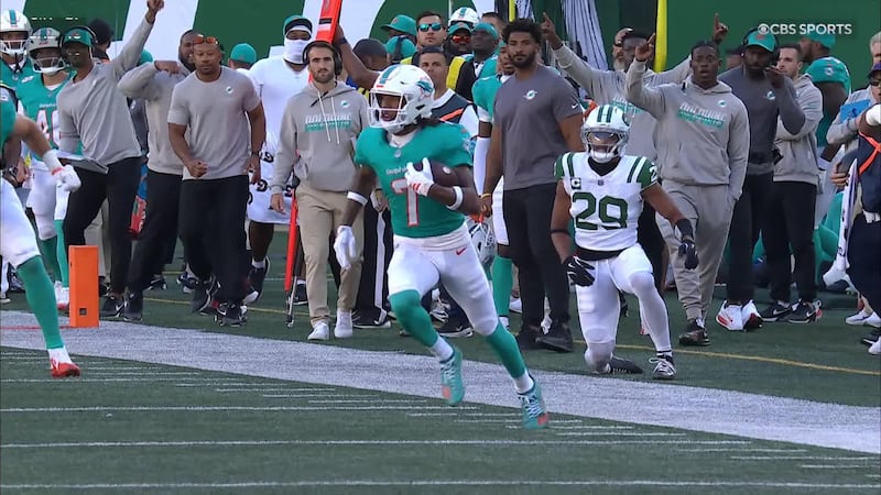 Caleb Douglas breaks a tackle for a 63-yard Dolphins TD