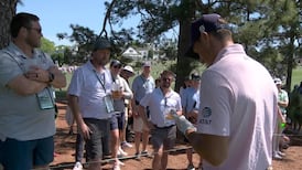 Jordan Spieth signs glove after errant tee shot hits fan