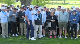 Must See: Rahm accidentally hits volunteer in face with clump of grass