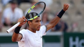 Auger-Aliassime overcame a shaky start to advance to the third round of Roland-Garros