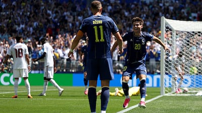 Dzeko creates Qatari own goal to extend Bosnia-Herzegovina's lead